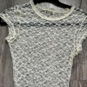 White lacy body suite by Free People